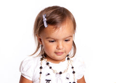 Mia® Baby Satin Barrettes - black and white mixed prints - shown on model - invented by #MiaKaminski #MiaBeauty #Mia #Beauty #Baby #hair #hairaccessories #hairclips #hairbarrettes #love #life #girl #woman