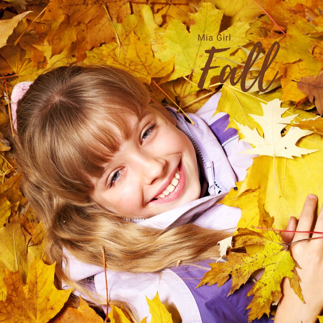 Mia Girl Fall girl in pile of leaves